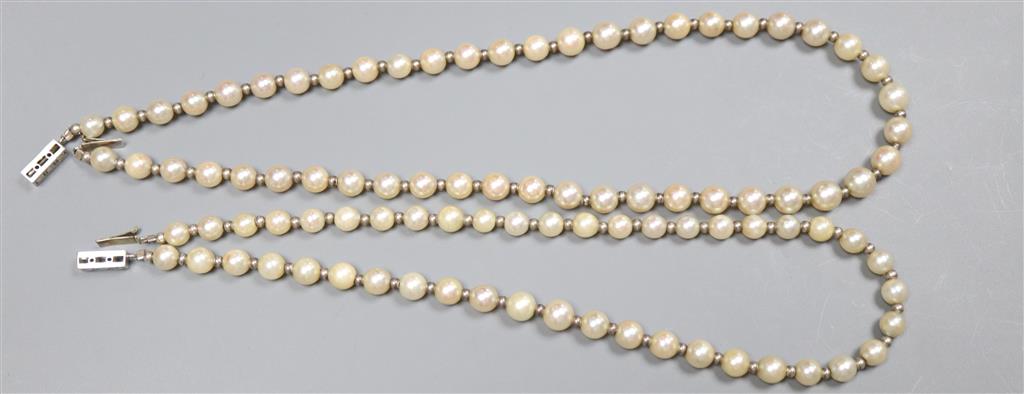 Two similar French silver strand cultured pearl necklaces with diamond set white metal( French 18ct poincon mark) clasps,